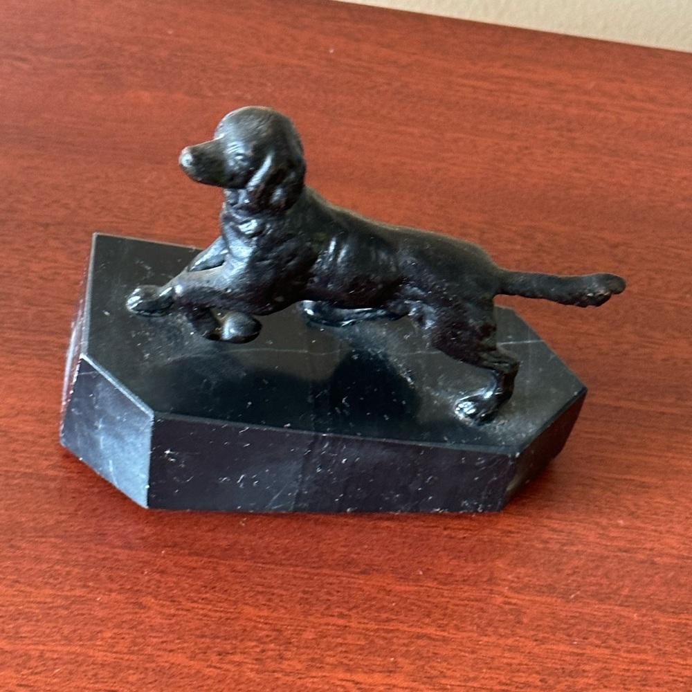 Very vintage heavy metal dog figurine on a marble stand Offers accept.